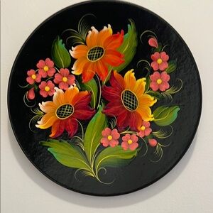 Folk art. Wooden painted plate for wall decoration